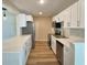 Modern kitchen features white cabinets, stainless steel appliances, and stylish countertops at 3701 Manatee Se Dr, St Petersburg, FL 33705