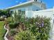 Beautiful landscaping with flowers and lush greenery surrounding a property's perimeter at 3701 Manatee Se Dr, St Petersburg, FL 33705