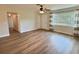 Bright, airy living room with wood-look floors and a large window, offering ample natural light at 3701 Manatee Se Dr, St Petersburg, FL 33705