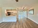 Open-concept living area showcasing the sleek flooring, modern lighting, and a seamless flow to the dining at 3701 Manatee Se Dr, St Petersburg, FL 33705