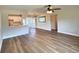 Open-concept living area showcasing the sleek flooring, modern lighting, and a seamless flow to the dining at 3701 Manatee Se Dr, St Petersburg, FL 33705