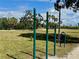 Neighborhood scene featuring an outdoor fitness area with lush greenery and palm trees, creating a vibrant community space at 3701 Manatee Se Dr, St Petersburg, FL 33705