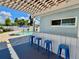 Outdoor patio area complete with a bar, pergola, and seating, perfect for entertaining by the pool at 3701 Manatee Se Dr, St Petersburg, FL 33705