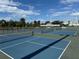 A view of multiple pickleball courts, ready for recreational play under a bright, partly cloudy sky at 3701 Manatee Se Dr, St Petersburg, FL 33705