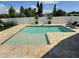 Inviting backyard pool with travertine deck, basketball hoop, and lounge chairs at 3701 Manatee Se Dr, St Petersburg, FL 33705