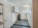 Functional utility room with water heater, cabinets, and doors, offering convenience and practicality at 3701 Manatee Se Dr, St Petersburg, FL 33705