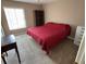 Comfortable bedroom featuring a window for natural light and plush carpeting at 3814 N Lake Dr # 65, Tampa, FL 33614
