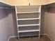 Walk-in closet featuring custom-built shelves for optimal storage solutions at 3814 N Lake Dr # 65, Tampa, FL 33614
