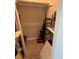 Inside of a cluttered storage closet; contains cleaning supplies and storage shelves at 3814 N Lake Dr # 65, Tampa, FL 33614