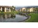 Scenic apartments overlook a tranquil pond with a charming wooden bridge at 3814 N Lake Dr # 65, Tampa, FL 33614