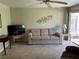 Cozy living room with ceiling fan and neutral colored walls with furniture for a relaxing atmosphere at 3814 N Lake Dr # 65, Tampa, FL 33614