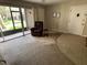 Living room with access to screened-in patio providing seamless indoor-outdoor living and natural light at 3814 N Lake Dr # 65, Tampa, FL 33614
