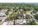 Aerial view of a residential neighborhood with mature trees and clear view of city skyline in distance at 3818 Grove S St, St Petersburg, FL 33705