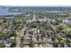 Aerial view of a coastal neighborhood with lush green trees and a view of the ocean at 3818 Grove S St, St Petersburg, FL 33705