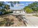 Spacious backyard with a large concrete pad, perfect for outdoor activities and entertaining guests at 3818 Grove S St, St Petersburg, FL 33705
