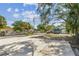 Open backyard with a concrete pad, chain-link fence, and a storage shed at 3818 Grove S St, St Petersburg, FL 33705