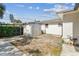 Private backyard with a storage shed, chain-link fence, and utility connections at 3818 Grove S St, St Petersburg, FL 33705