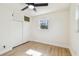 Bedroom featuring wood-look floors, closet, and one window for natural light at 3818 Grove S St, St Petersburg, FL 33705