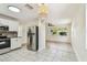 Spacious kitchen with stainless steel appliances, tile floor, and seamless flow to living areas at 3818 Grove S St, St Petersburg, FL 33705