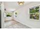 Living room with an eat-in area featuring tile flooring and large windows that let in natural light at 3818 Grove S St, St Petersburg, FL 33705