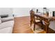 This office features a sofa, wood floors, and an ornate wood desk and chair at 3866 Mariner Dr, St Petersburg, FL 33705