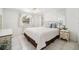 Inviting bedroom with tile flooring, white furniture, a comfortable bed, and a bright window at 4229 Glissade Dr, New Port Richey, FL 34652
