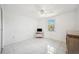 Bright bedroom with tile flooring, a window with natural light, and a ceiling fan at 4229 Glissade Dr, New Port Richey, FL 34652