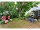 Relaxing backyard with a swing, table and chairs at 4411 W Bay Villa Ave, Tampa, FL 33611