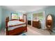 This bedroom features a full bed, two dressers, and plenty of natural light at 4411 W Bay Villa Ave, Tampa, FL 33611