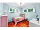 Bright bedroom with wood floors and large windows at 4411 W Bay Villa Ave, Tampa, FL 33611