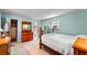 A bright bedroom with a full bed, dressers, and ample closet space at 4411 W Bay Villa Ave, Tampa, FL 33611