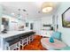 Modern kitchen with a large center island, bar stool seating, and stylish pendant lighting at 4411 W Bay Villa Ave, Tampa, FL 33611