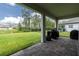 Enjoy the outdoors from this covered patio with a view of the expansive backyard at 4496 Tatum Loop, Odessa, FL 33556