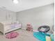 Cozy bedroom featuring a daybed, colorful rugs, and playful decor elements for a whimsical feel at 4496 Tatum Loop, Odessa, FL 33556