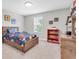 Charming bedroom featuring a wooden bedframe with built-in storage drawers and colorful decor at 4496 Tatum Loop, Odessa, FL 33556