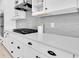 Modern kitchen featuring white cabinets, quartz countertops, and stainless steel appliances at 4496 Tatum Loop, Odessa, FL 33556