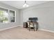 Home office features large window and a wooden desk at 4496 Tatum Loop, Odessa, FL 33556