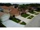 Charming single-Gathering home featuring a manicured lawn, mature landscaping, and a two-car garage at 4535 Gateway Blvd, Wesley Chapel, FL 33544
