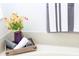 Bathroom details include striped towels, floral arrangement and soaking tub at 4535 Gateway Blvd, Wesley Chapel, FL 33544