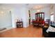 Cozy dining area features wood floors, cabinet, table and six chairs in a naturally lit space at 4535 Gateway Blvd, Wesley Chapel, FL 33544
