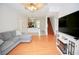 Living room showcases wood flooring, open floor plan, neutral paint, and staircase at 4535 Gateway Blvd, Wesley Chapel, FL 33544