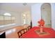 Bright living room features arched doorways, light-colored walls, wood floors and natural light at 4535 Gateway Blvd, Wesley Chapel, FL 33544