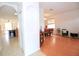 Open concept design of kitchen, dining and living room featuring laminate flooring and natural light at 4535 Gateway Blvd, Wesley Chapel, FL 33544