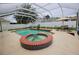 Beautiful backyard swimming pool and hot tub in screened in enclosure with patio at 4535 Gateway Blvd, Wesley Chapel, FL 33544