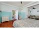 Comfortable bedroom with beautiful quilt, wood floors, and bright natural light at 457 8Th N Ave, St Petersburg, FL 33701