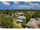 Charming home featuring a metal roof, inviting front porch, and beautifully landscaped yard in a peaceful neighborhood setting at 457 8Th N Ave, St Petersburg, FL 33701