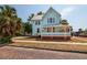 Beautiful light blue two-story home with a cozy wrap-around porch at 457 8Th N Ave, St Petersburg, FL 33701