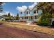 Charming light blue two-story home with a large porch and beautiful landscaping at 457 8Th N Ave, St Petersburg, FL 33701