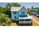 Charming two-story home with a wraparound porch and light blue painted wood facade at 457 8Th N Ave, St Petersburg, FL 33701