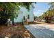 Exterior of the house with blue paint, trees and a parking area at 457 8Th N Ave, St Petersburg, FL 33701